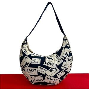 Yves Saint Laurent Black and White Love Print Hobo Bag